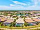 Stunning aerial view of a lakeside community with well-maintained homes and beautiful landscaping at 20126 Elegante Ct, Venice, FL 34293