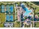 Aerial view showcasing tennis courts, a resort-style pool, and beautifully landscaped grounds at 20126 Elegante Ct, Venice, FL 34293