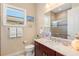 Cozy bathroom with a marble vanity, and decorative accents, providing an inviting and functional space at 20126 Elegante Ct, Venice, FL 34293