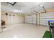 Large garage with storage and two car doors provides ample space for vehicles and more at 20126 Elegante Ct, Venice, FL 34293