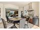 Inviting outdoor kitchen and dining area with built-in grill at 20126 Elegante Ct, Venice, FL 34293