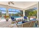 Outdoor living area with seating, ceiling fan, and view of the pool at 20126 Elegante Ct, Venice, FL 34293