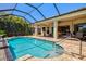 Private screened-in pool and patio area leading to the living spaces at 20126 Elegante Ct, Venice, FL 34293
