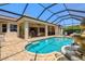 Sparkling private pool with fountain and covered patio at 20126 Elegante Ct, Venice, FL 34293