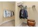 Spacious walk-in closet providing ample storage with shelves, rods, and a storage box at 20126 Elegante Ct, Venice, FL 34293