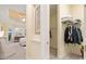 View from the bedroom showing a walk-in closet with shelves and plenty of storage space at 20126 Elegante Ct, Venice, FL 34293