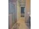Bathroom featuring a glass enclosed shower and access to the bedroom at 20188 Tesoro Dr, Venice, FL 34293