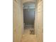 Bathroom featuring access to a toilet with chandelier lighting and large closets at 20188 Tesoro Dr, Venice, FL 34293