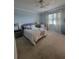 Comfortable bedroom with plush carpeting, soft lighting, and a serene ambiance at 20188 Tesoro Dr, Venice, FL 34293