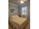 Cozy bedroom with neutral tones, plush carpeting, and a comfortable bed with soft linens at 20188 Tesoro Dr, Venice, FL 34293