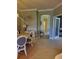 Inviting dining room with a decorative clock, elegant buffet, and a view into other rooms at 20188 Tesoro Dr, Venice, FL 34293