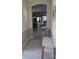Welcoming foyer with an entry bench and rug, leading into an open living space at 20188 Tesoro Dr, Venice, FL 34293