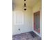 Inviting front entrance with a stylish light fixture, decorative window, and decorative brick flooring at 20188 Tesoro Dr, Venice, FL 34293
