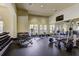 A modern gym with an array of weight-training machines and free weights for resident fitness at 20188 Tesoro Dr, Venice, FL 34293