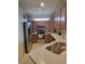 Updated kitchen boasts stainless steel appliances, quartz countertops, and ample cabinet space at 20188 Tesoro Dr, Venice, FL 34293