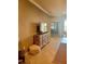 Cozy living room featuring a rustic wood media cabinet and neutral decor at 20188 Tesoro Dr, Venice, FL 34293