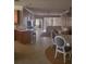 View of the main living space showing the connection between the kitchen, dining and living areas at 20188 Tesoro Dr, Venice, FL 34293