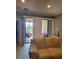 Cozy living room featuring sliding glass doors that offer a view of the outdoor patio at 20188 Tesoro Dr, Venice, FL 34293
