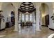 Grand lobby entrance with high ceilings, pillars, and elegant furniture at 20188 Tesoro Dr, Venice, FL 34293