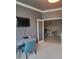 Office space featuring a mounted TV and an open view to the dining area at 20188 Tesoro Dr, Venice, FL 34293