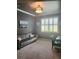 Office featuring a large window, shutter blinds, and comfortable gray furniture at 20188 Tesoro Dr, Venice, FL 34293