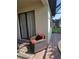 Comfortable outdoor seating area with a wicker chair and a patio rug, perfect for relaxing at 20188 Tesoro Dr, Venice, FL 34293