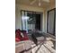 Relaxing patio area with a comfortable couch, offering an inviting space for outdoor leisure at 20188 Tesoro Dr, Venice, FL 34293