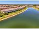 Aerial view of waterfront townhomes with well-maintained landscaping at 20237 Lagente Cir, Venice, FL 34293