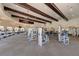The gym features state-of-the-art equipment and ceiling fans beneath exposed wooden beams at 20237 Lagente Cir, Venice, FL 34293