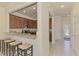 Beautiful kitchen view with breakfast bar, stainless appliances, and granite countertops at 20237 Lagente Cir, Venice, FL 34293