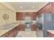 Well-equipped kitchen with stainless steel appliances and granite countertops at 20237 Lagente Cir, Venice, FL 34293