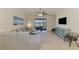 Spacious living room featuring a large sectional sofa and stylish decor at 20237 Lagente Cir, Venice, FL 34293