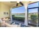 Relaxing screened lanai with comfortable seating and scenic views of the lake at 20237 Lagente Cir, Venice, FL 34293