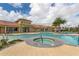 Community pool with spa and seating, providing a place to relax and socialize with neighbors at 20285 Symphony Pl, Venice, FL 34293