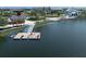 Scenic view of dock area featuring a kayak launch and lakeside recreational activities at 20285 Symphony Pl, Venice, FL 34293