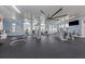 Community gym featuring a variety of modern exercise equipment and ample natural light at 20285 Symphony Pl, Venice, FL 34293