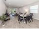 Open floor plan with dining area, and a comfortable sectional sofa at 20285 Symphony Pl, Venice, FL 34293