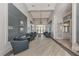Lobby area featuring comfortable seating, elegant chandelier, and stylish decor for a welcoming ambiance at 20285 Symphony Pl, Venice, FL 34293