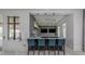 Modern lounge area with stylish bar, comfortable seating, and contemporary design elements at 20285 Symphony Pl, Venice, FL 34293