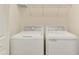 A functional laundry room featuring a side by side washer and dryer set at 20290 Lagente Cir, Venice, FL 34293