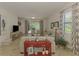 Spacious living room showcasing neutral furniture, tile flooring and sliders to the lanai at 20290 Lagente Cir, Venice, FL 34293