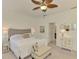 A bright main bedroom featuring beach themed wall art and elegant furnishings at 20290 Lagente Cir, Venice, FL 34293