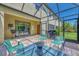 An outdoor patio with an outdoor table and chairs with views of the backyard at 20290 Lagente Cir, Venice, FL 34293
