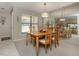 Dining room features a wooden table with four chairs and a large mirror creating an open ambiance at 229 Southampton Drive # 290, Venice, FL 34293
