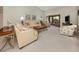Expansive living room with abundant natural light, vaulted ceiling, and plush seating arrangements at 229 Southampton Drive # 290, Venice, FL 34293