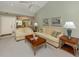 Spacious living room with neutral decor, vaulted ceiling, and large sofas at 229 Southampton Drive # 290, Venice, FL 34293