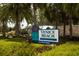 Venice Beach sign featuring lush greenery, palm trees, and clear blue skies at 229 Southampton Drive # 290, Venice, FL 34293