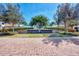 Elegant community entrance with a brick sign and manicured landscaping for a welcoming first impression at 23494 Copperleaf Dr, Venice, FL 34293