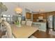 Dining area offering view into updated kitchen and living area with hardwood floors, ideal for entertaining and Gathering gatherings at 23516 Peachland Blvd, Port Charlotte, FL 33954