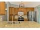 Stylish kitchen featuring granite countertops, stainless steel appliances, and hardwood flooring, a chef's dream at 23516 Peachland Blvd, Port Charlotte, FL 33954
